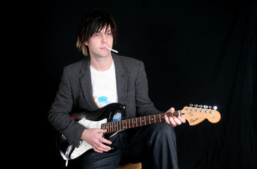 Obraz premium guitar player with cigarette