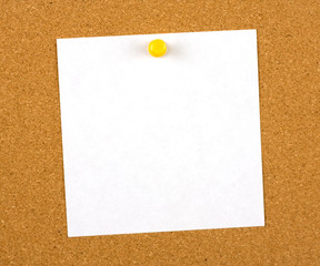 A blank note (for your message) pinned to a cork notice board