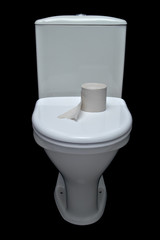 white iavatory pan with toilet paper on black background