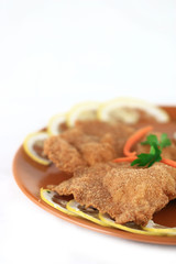 close up of a pork schnitzel in a plate