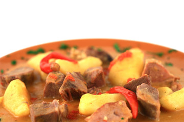 close up of a steak and potatoes arranged in a plate