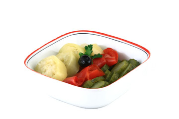 close up of a vegetable garnish in a white bowl