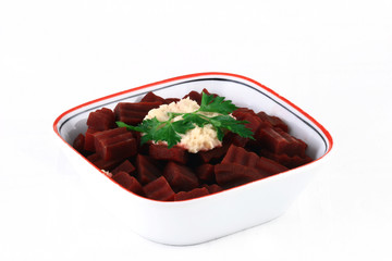 close up of a vegetable garnish in a white bowl