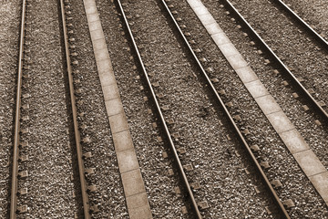 Three parallel railway tracks toned in sepia color