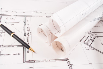 Plans of a house designed by an architect with a black pen