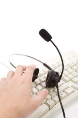 a black headset and keyboard close up