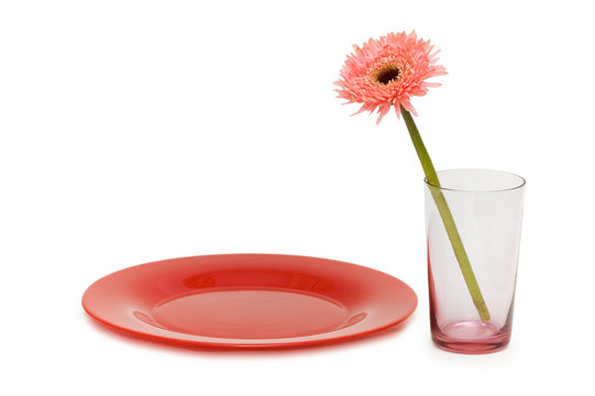 Flower And Red Plate Isolated On The White