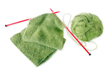 Knitting a green fluffy woollen scarf