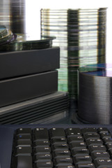 A computer keyboard before data storage mediums. 