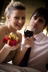 couple having a romantic dinner in restaurant, (or home)