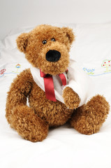 a teddy bear at the hospital with a fractured arm in a sling