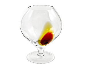 Decorated cognac glass on white background, clipping path.