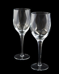 Two crystal wine glasses on dark background