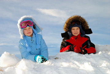 Fototapeta na wymiar Children playing in snow
