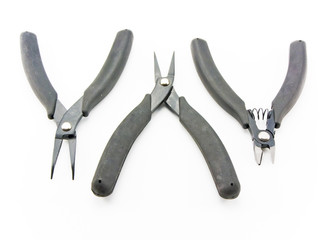 Set of nippers with plastic handles on a white background