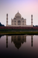 Fototapeta premium The Taj Mahal mausoleum reflecting in the Yamuna river