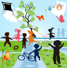 happy kids silhouettes playing in a parck