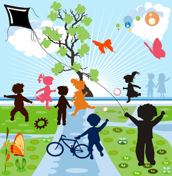 happy kids silhouettes playing in a parck