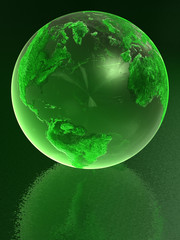 Green glass globe with reflection