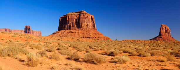 A panorama of Merrick Butte between two Mittens