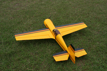 remote controlled toy airplane parked on the grass