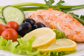 Stake from a trout with vegetables close up