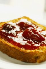 Close up of a toast with strawberry jam