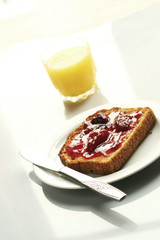 Strawberry jam toast and orange juice