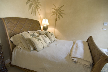 Tropical style rattan bedroom with pillows