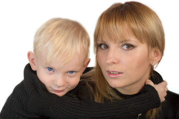 Mother and son looking at you with interest isolated