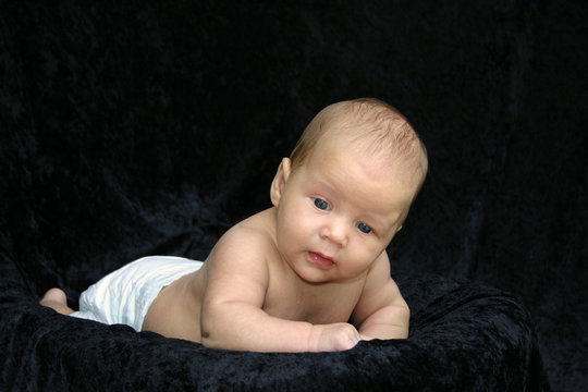 Newborn Baby On Black Background