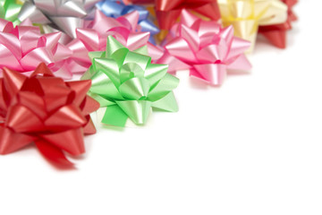 Plenty of colorful bows on a white background