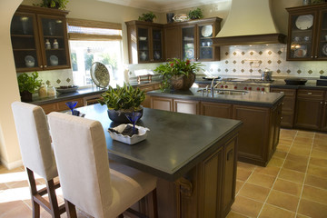 Fototapeta na wymiar Luxury home kitchen with a granite island.