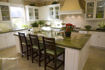 Luxury home kitchen with a granite island.