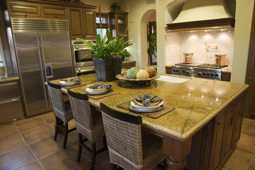 Luxury home kitchen with a granite island.
