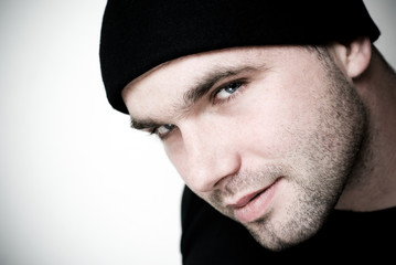 Portrait of young man wearing beanie.