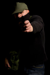 Disguised gunman pointing handgun in your face