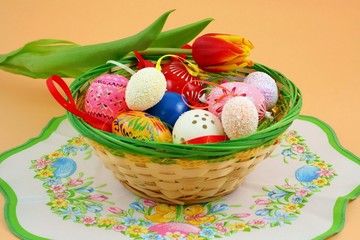 Basket full of easter decorations  - easter eggs and tulip