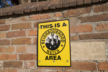 Obraz premium A neighbourhood watch sign.