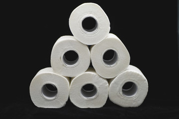 a lot of toilet papers on black background