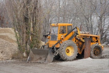Old excavator parking at a construction site