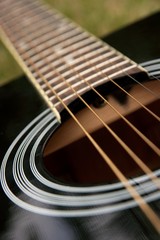 Black acoustic guitar, (shallow dof)