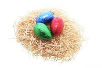  Easter Eggs on Straw Nest on White Background