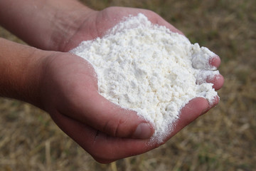 Fototapeta na wymiar Flour in hands
