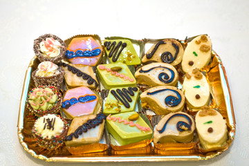 a tray wiht differents sweet cake and pastry