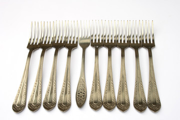 On a photo of a fork. A photon a white background.