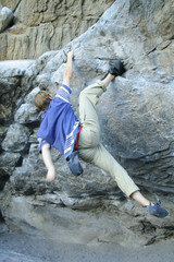 rock climber scalling a wall