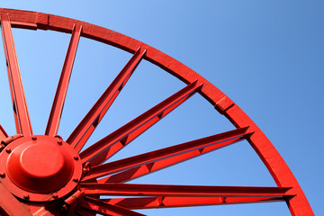 Vintage mine shaft pulley wheel. Industrial detail.