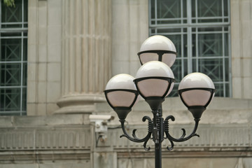 unlit lamppost during the day
