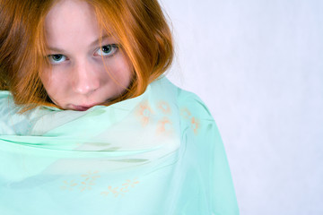 Portrait of  innocent looking young woman with a veil.